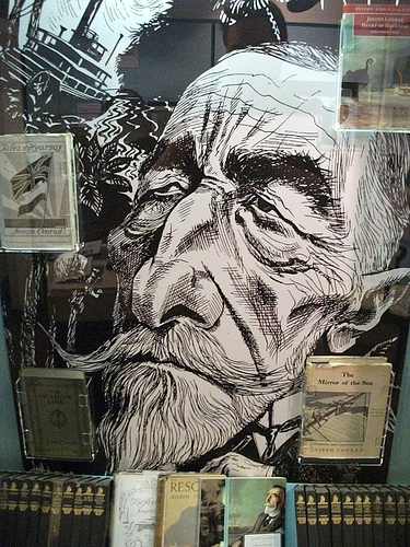 Drawing of Conrad surrounded by his books through glass